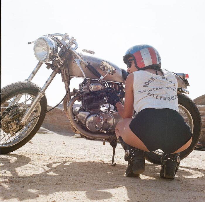 A playful frame from Girls on a motorcycle — online in Houston
